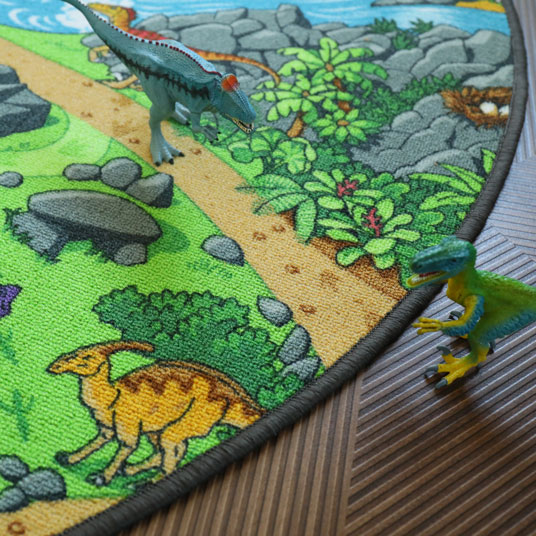 Tapis rond de jeu enfant circuit volcans et dinosaures - vue de près