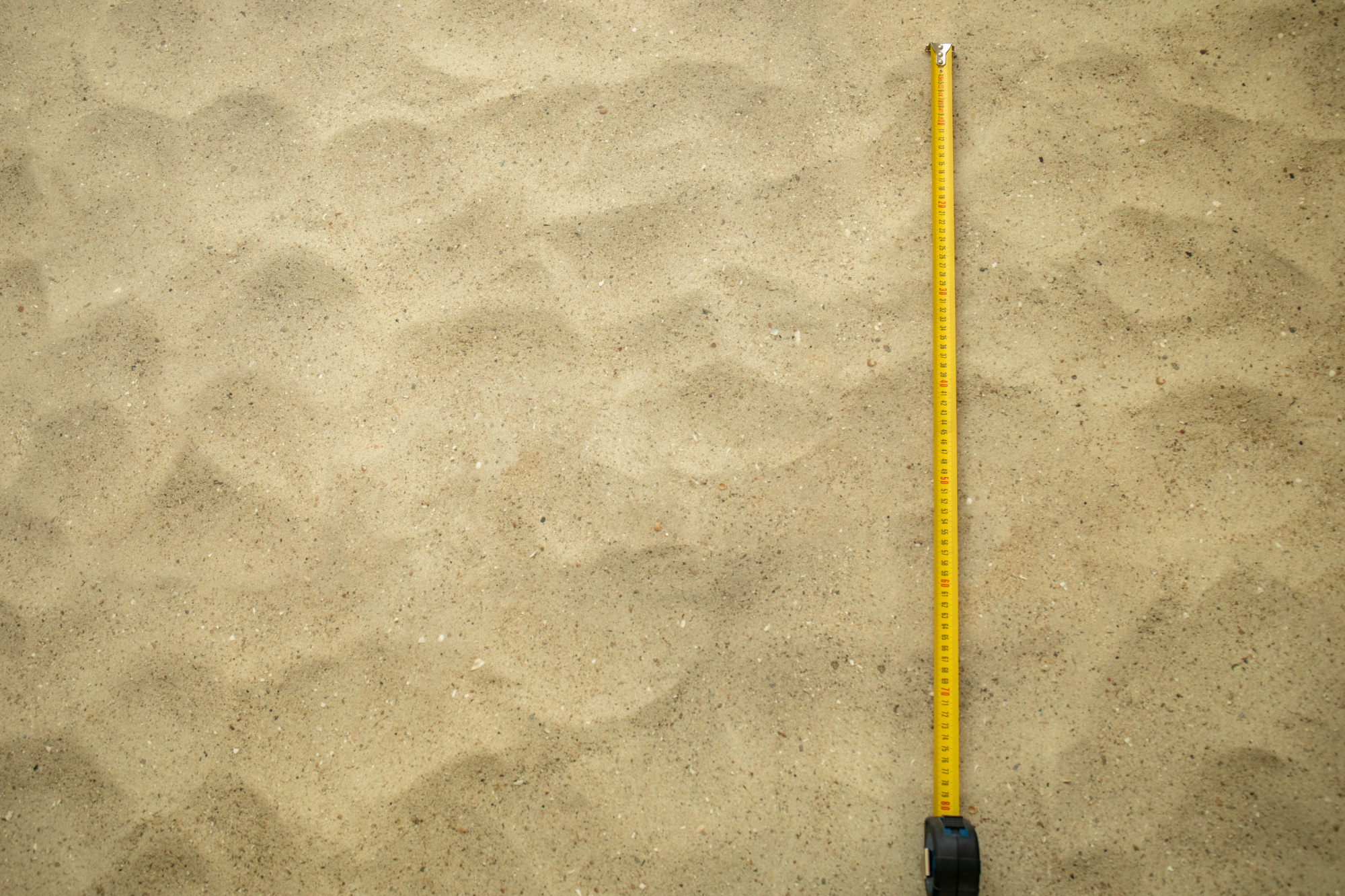 Revêtement vinyle Relief 3D motif plage de sable, aperçu de la taille réelle du décor grâce au mètre