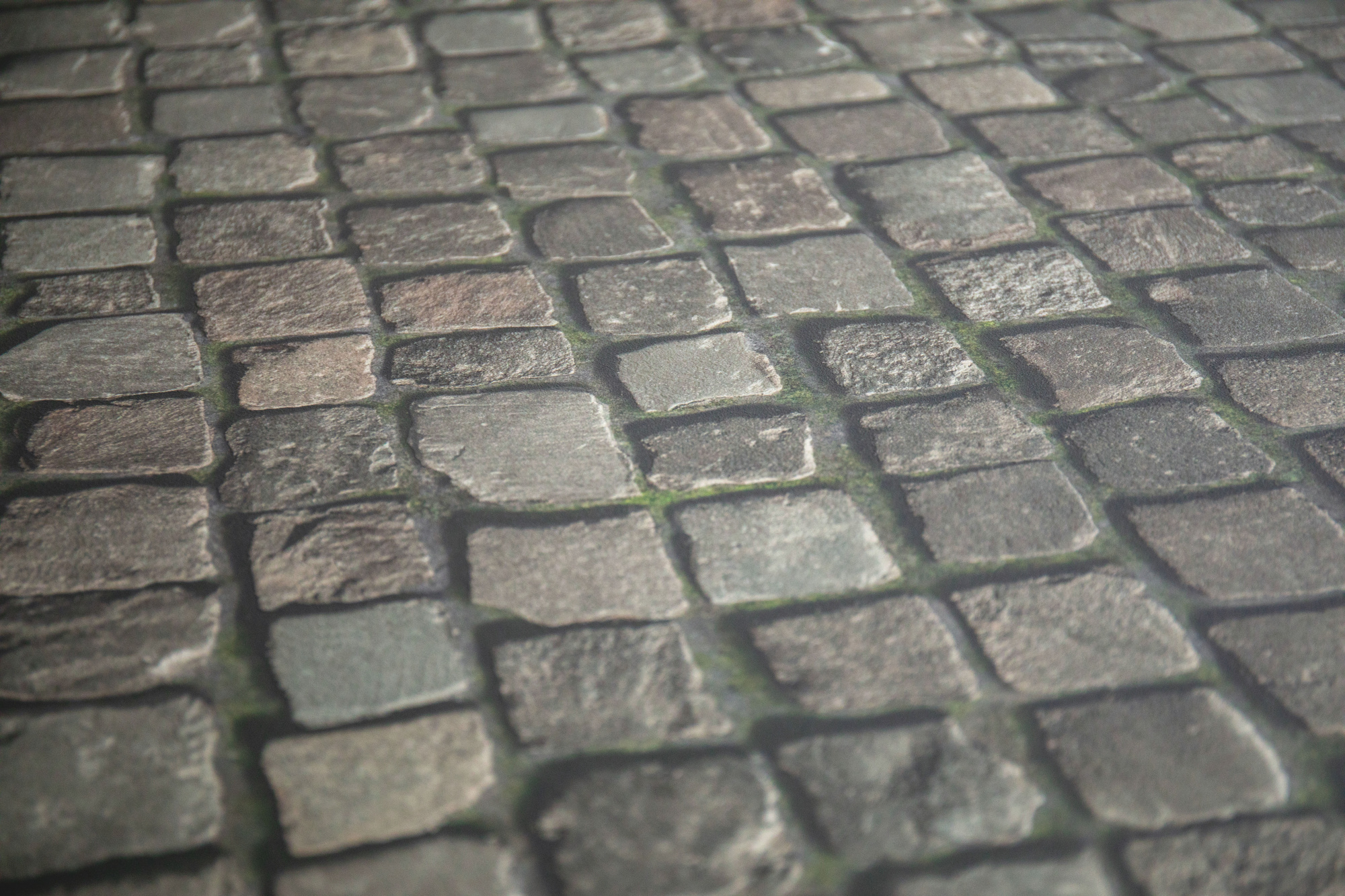 Sol Vinyle Textile - Relief 3D - Imprimé pavés anciens de ville en perspective, montrant l’effet relief et la profondeur du décor