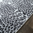 Tapis toucher soft - Imprimé léopard - Patchwork noir et blanc - Tranche