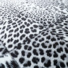 Tapis toucher soft - Imprimé léopard - Patchwork noir et blanc - gros plan
