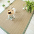 Tapis jonc de mer Bihar fin chevron finition vert mousse - salon