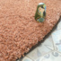 Tapis rond Icone shaggy terracotta galon marron - vue de près