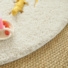Tapis rond Icone shaggy crme galon blanc coton - gros plan