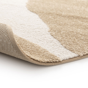 Tapis Stone marron clair motifs organiques détail finition assortie