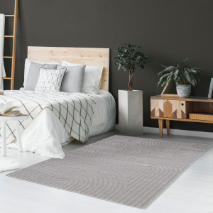 Tapis de salon en relief - Circle - Courbe gris chaud installé en descente de lit