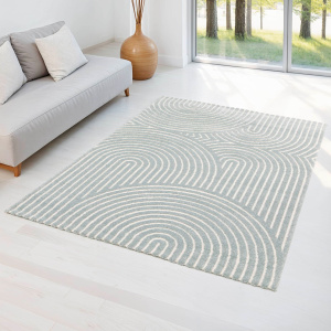 Tapis en relief Circle gris bleuté et crème, ambiance douce et lumineuse dans salon épuré