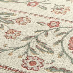 Détail motif floral du tapis en tissu chenille recyclé Minia Pêche au tissage jacquard façon gobelin
