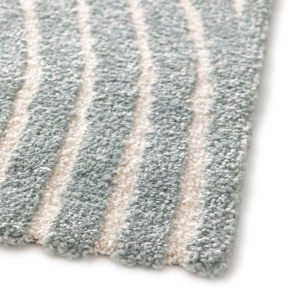 Texture bouclée et contrastes de niveaux du tapis Circle - Courbe gris bleuté et crème