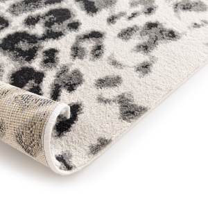 Motif léopard moderne sur fond clair, envers du tapis Léopard urbain