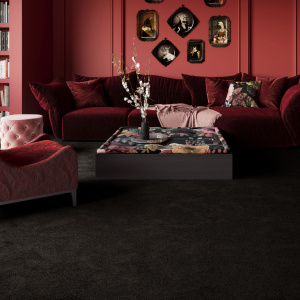 Moquette ultra douce Pulse Noir graphite au toucher soyeux, dans un salon à l'atmosphère chaleureuse et feutrée