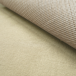 Moquette haute résistance Sylon crème moquette relevée montrant la structure du revêtement
