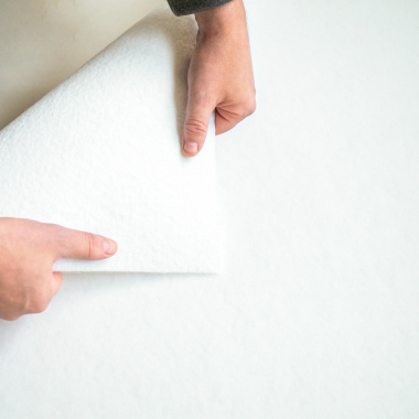 Vue de l'envers de la moquette professionnelle Revexpo Blanc pour évènementiel