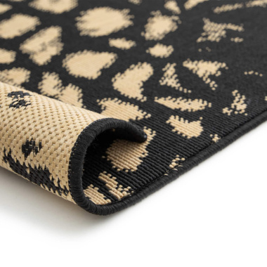 Finition du tapis léopard noir et doré – bordure renforcée et tissage premium