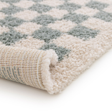Bordure et envers du tapis damier à poils longs Colorama vert d'eau