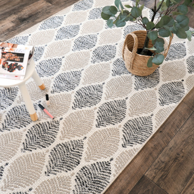 Tapis feuilles Essenza Nature urbaine, design végétal moderne et chaleureux