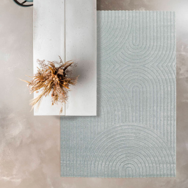 Tapis de salon en relief Circle courbe gris bleuté sous table design béton clair