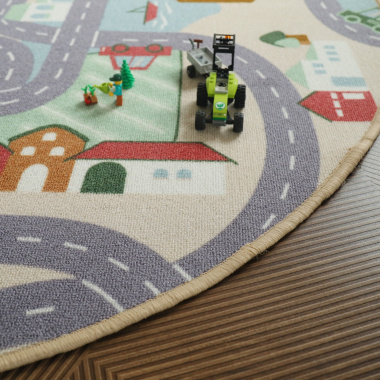 Tapis rond de jeu enfant circuit de voiture campagne - gros plan