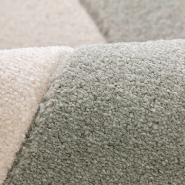 Gros plan tapis Luna Pop contraste subtil courbe graphique et fond clair