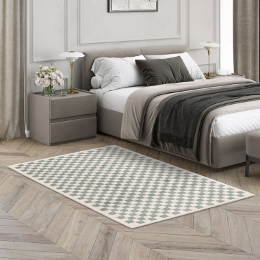 Ambiance apaisante avec le tapis damier Colorama vert d’eau dans une chambre