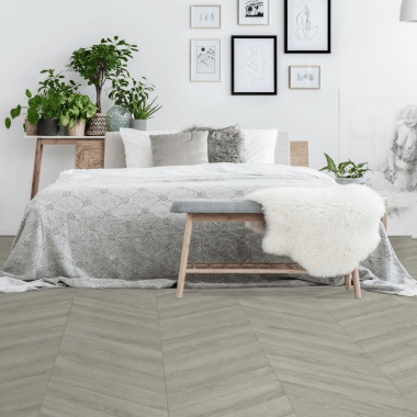 Sol vinyle Inspiration parquet en chevron chêne gris - chambre