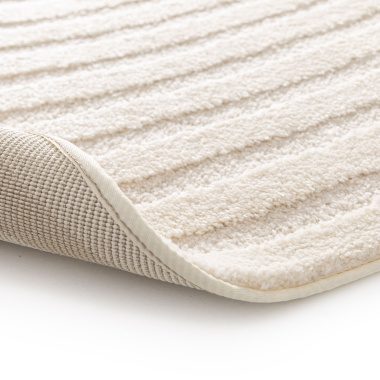 Envers du tapis de forme ovale organique en relief - Circle - Cercle crème, bord cousu et structure tissée