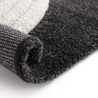 Tapis de salon en relief Modern Circle noir et crème - envers