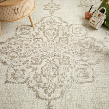 Tapis Orient beige tendre dans une ambiance cosy avec éléments déco