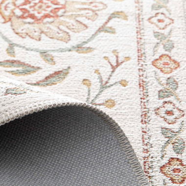 Envers et détail du tapis Minia Pêche en tissu chenille recyclé, souple et facile d’entretien