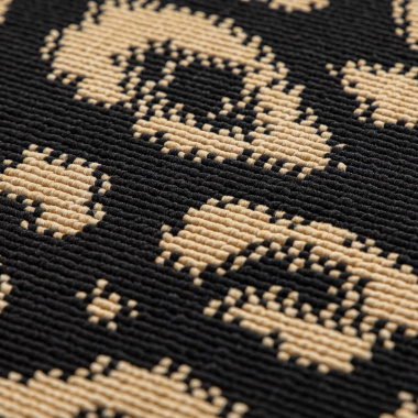 Texture du tapis léopard noir et doré – relief graphique chic et contemporain