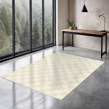 Tapis graphique Petit Marius posé dans un intérieur minimaliste face à une baie vitrée