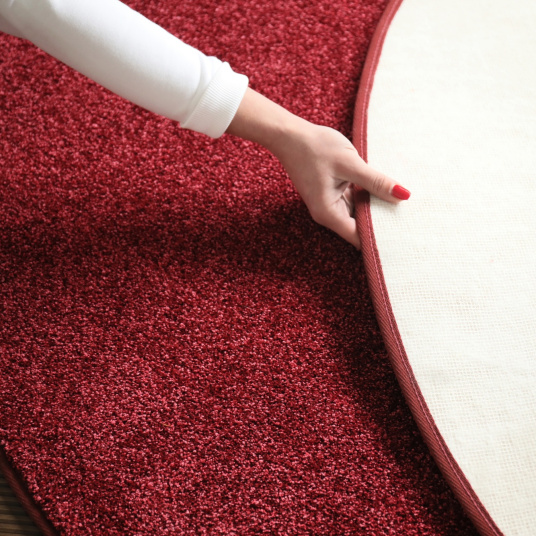 Envers et finition du tapis de salon rond en velours Feelings Rouge passion 