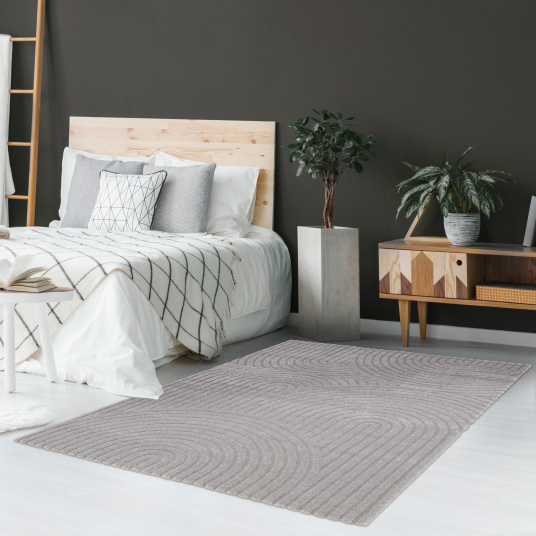 Tapis de salon en relief - Circle - Courbe gris chaud installé en descente de lit