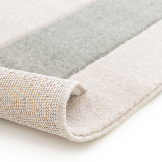 Vue sur l'envers du tapis Luna Pop avec trame régulière et solide