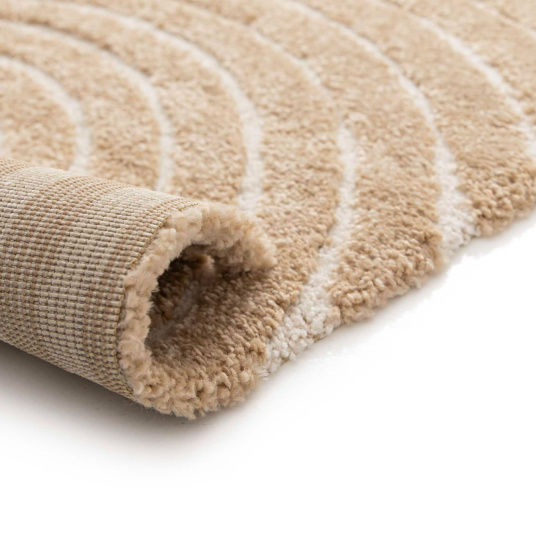 Zoom sur le bord du tapis Circle - Courbe beige et crème, tissage doux