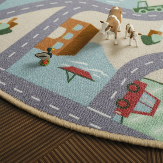 Tapis rond de jeu enfant circuit de voiture campagne - gros plan