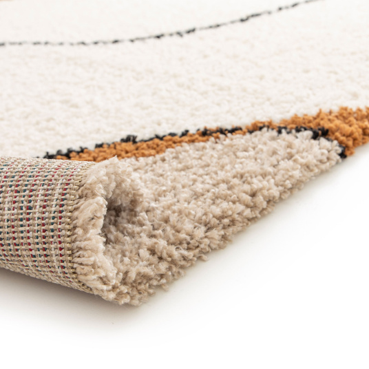 Tapis style berbère Courbes du Désert beige et marron, bord enroulé montrant la base structurée