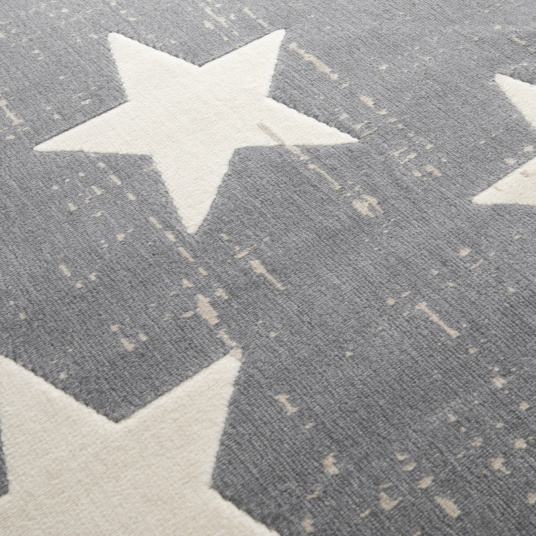 Détail du motif étoile sur le tapis chambre d'enfant Star Vintage gris foncé