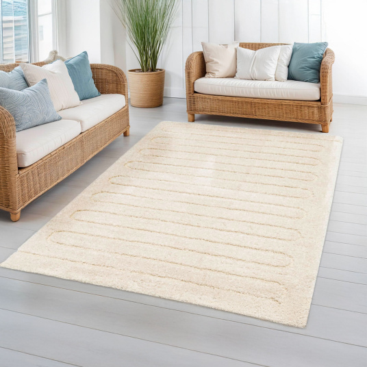 Tapis Zig-Zag crème dans salon lumineux ambiance naturelle rotin