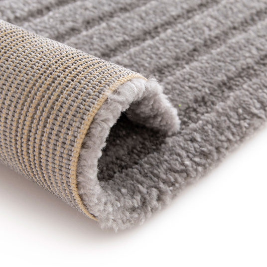 Dessous du tapis de salon en relief Circle - Courbe gris chaud, finition soignée