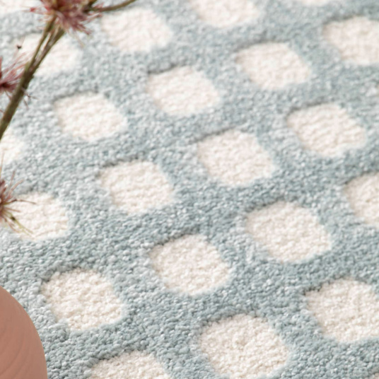 Zoom sur la texture du tapis Art Abstrait, contraste subtil et élégant