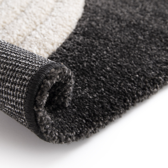 Tapis de salon en relief Modern Circle noir et crème - envers