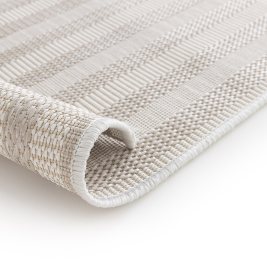 Bordure et tissage du tapis Graphic Line beige, matière recyclée et finition soignée