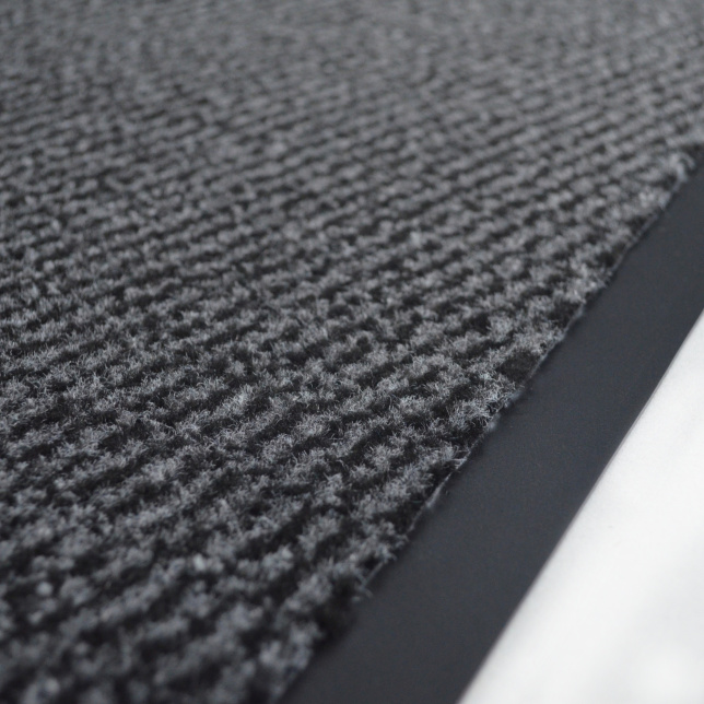 Détail du Tapis paillasson pour porte d'entrée – Anthracite, surface tuftée et semelle PVC visible
