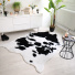 Tapis peau de bte - Imitation vache Holstein - Noir et blanc - Ambiance Salon