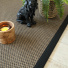 Tapis naturel en Sisal Slow bronze ganse noire - salon