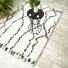 Tapis motif berbre  poils longs - Itahari - Noir et blanc cass - Vue de loin