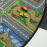 Tapis rond de jeu enfant circuit de voiture ville - vue du dessus