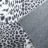 Tapis toucher soft - Imprim lopard - Patchwork noir et blanc - envers