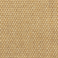 Zoom sur la texture du tapis en sisal Tulum coloris miel avec assiette en bois et fruits oranges